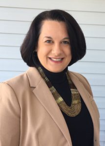 Headshot Photo of Jeanne DelColle